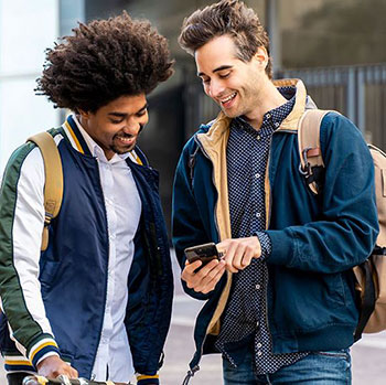 friends looking at mobile phone