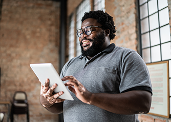 man holding a tablet