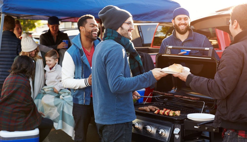 football fans tailgating before a game