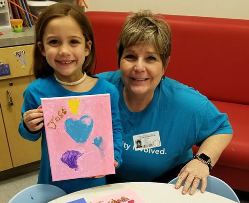 Delta Community employee volunteering at a Patient Party