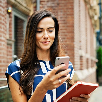 woman looking at mobile phone