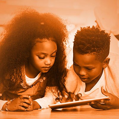 Two children playing with tablet