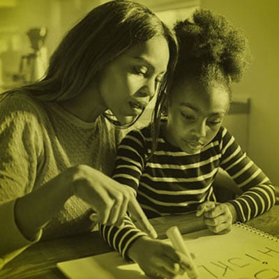 Volunteer working with child