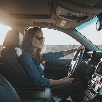 young woman driving car