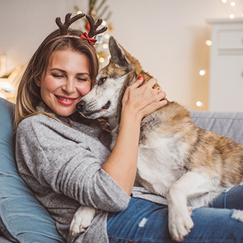 woman and dog on couch