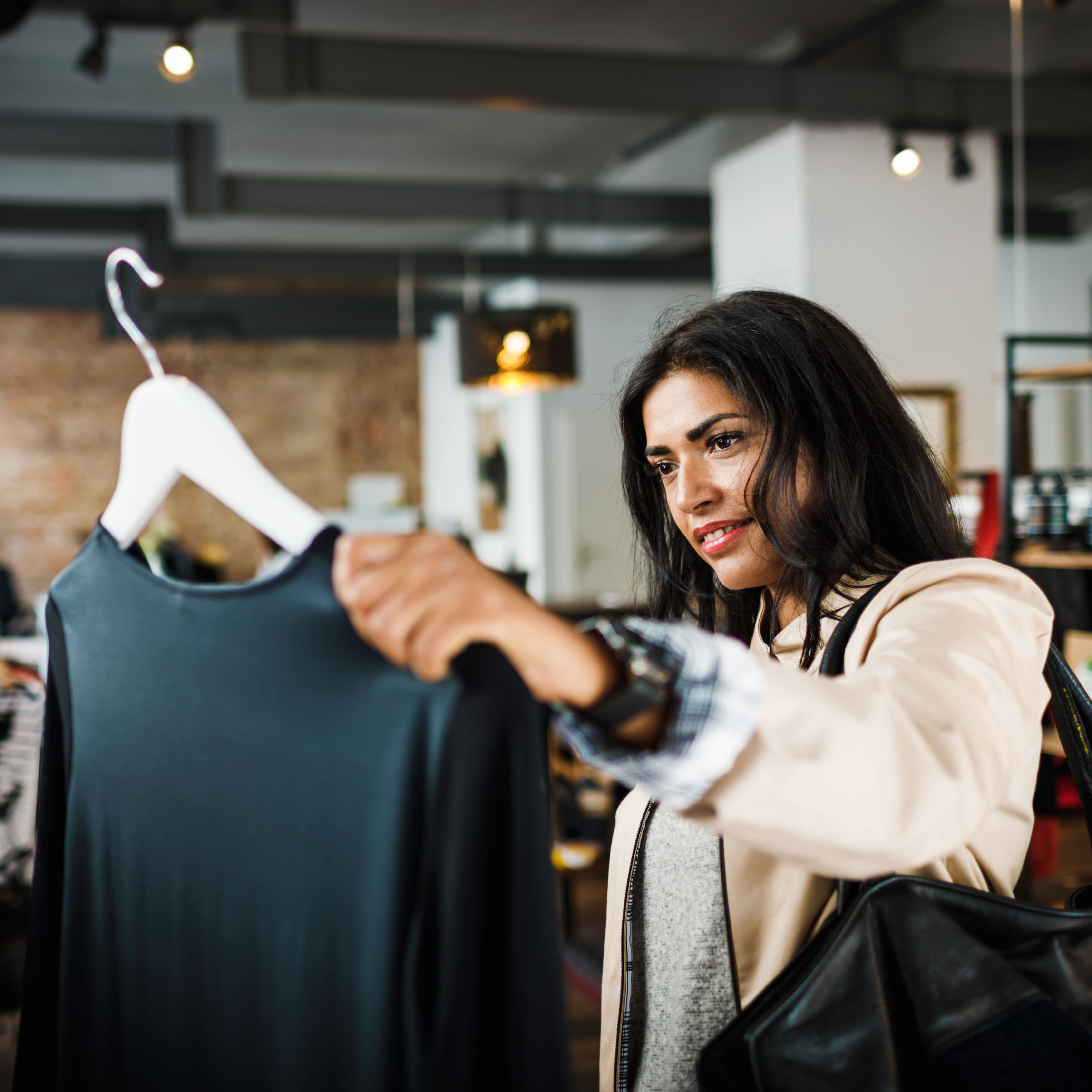 woman shopping in clothing store