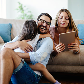 family relaxing and laughing