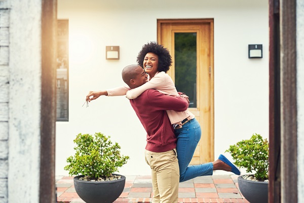 young couple celebrating first home