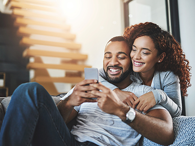 young couple looking at phone